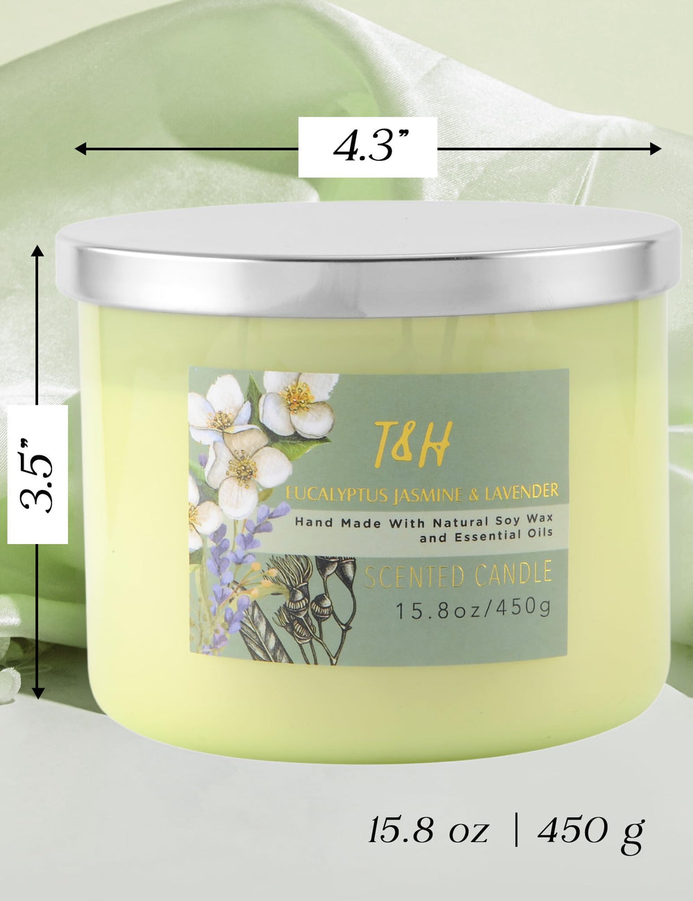 Candle with lid off displaying green glass jar and label