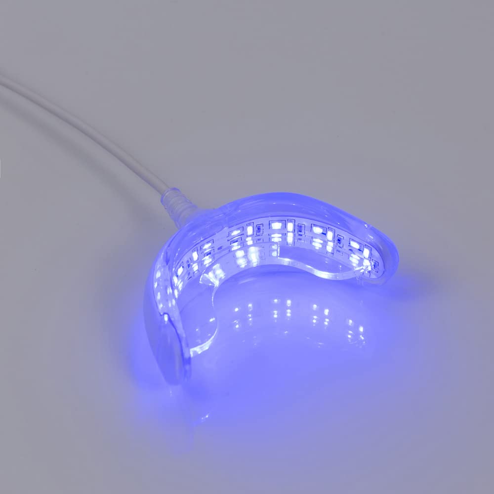 User inserting whitening gel into mouth tray