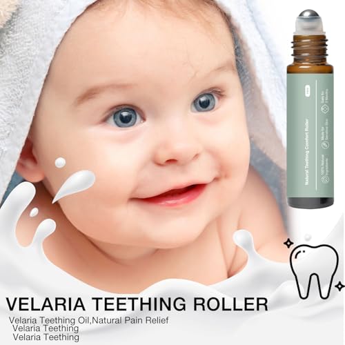 Baby applying teething roller to gums