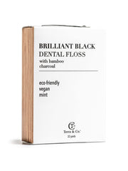 High-contrast black floss demonstrating visual cleaning