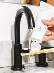 Contrasting black dental floss in use