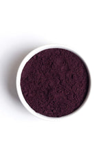 Elderberry powder being added to smoothie