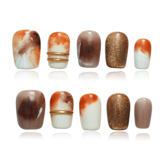 Tesytto brown press-on nails with 3D gold lines and marble ombre close-up for luxe look