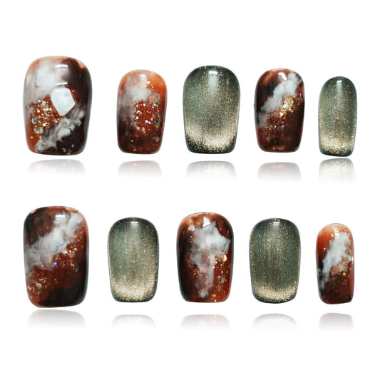 Tesytto dark green cat eye nails in coffin shape with watercolor marble finish for elegant daily wear.