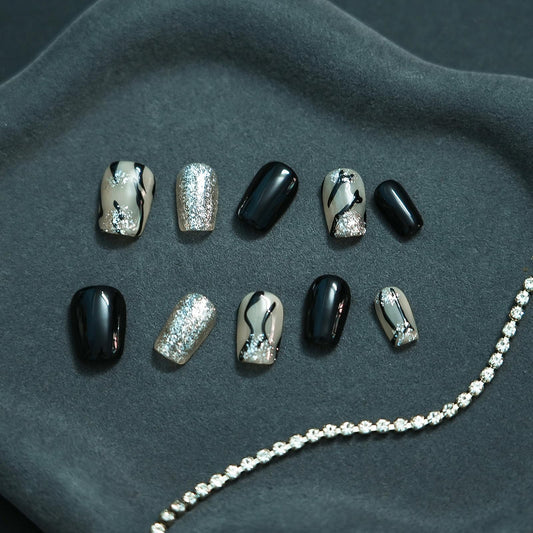 Tesytto marble press-on nails with silver glitter for festive sparkle.