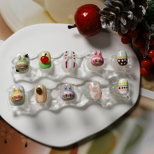 Tesytto mini bow charms nails with pastel tones for playful outfits