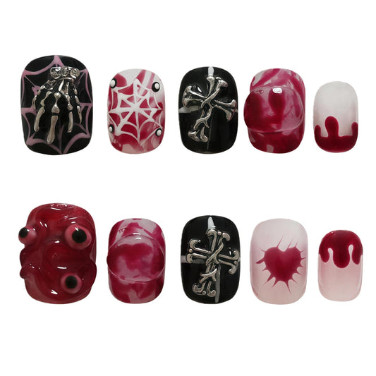 Tesytto Nightmare Before Christmas nails with skeleton and cross eyes for a bold Halloween look.