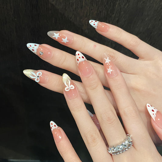 Tesytto Leopard Nails with gold glitter French tip for party-ready style.