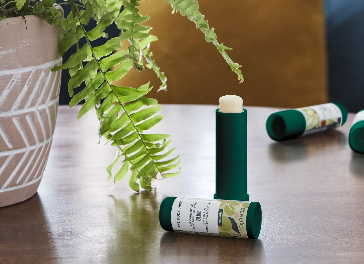 The Body Shop Olive Lip Care Stick features olive-enriched formula for lasting hydration on dry lips.
