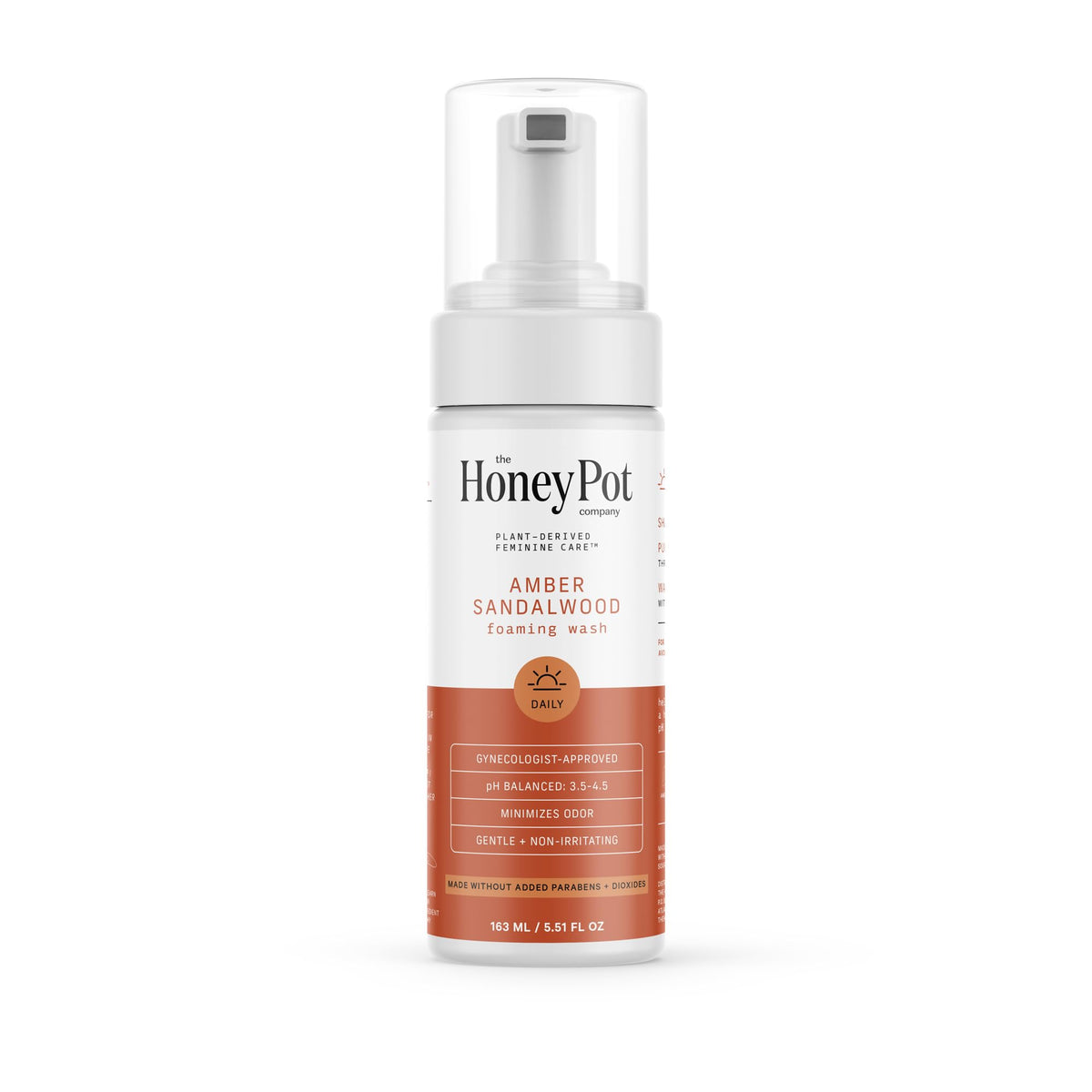 The Honey Pot Amber Sandalwood bottle closeup highlighting gentle plant-based feminine wash for sensitive skin.