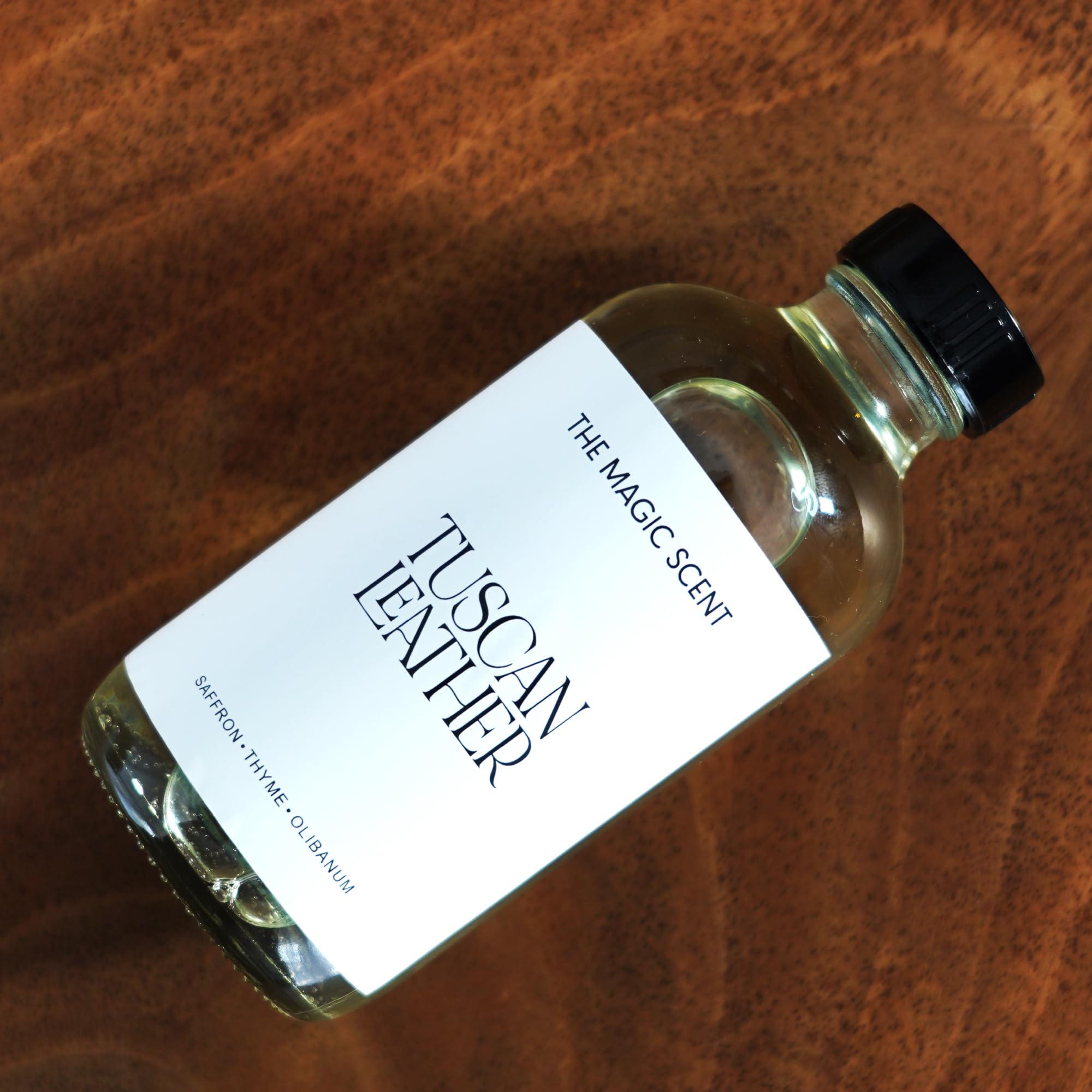 The Magic Scent Tuscan Leather diffuser oil on a premium surface