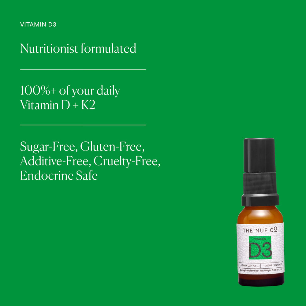 A hand applying The Nue Co Vitamin D Spray for daily use