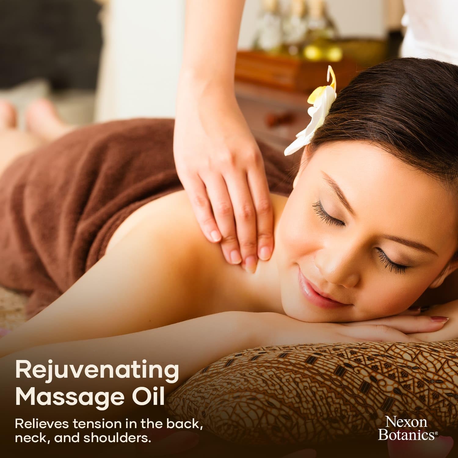 Massage therapist applying the oil during therapy