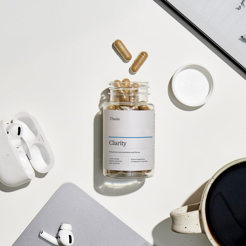 Thesis Clarity bottle placed on a desk in a lifestyle setting