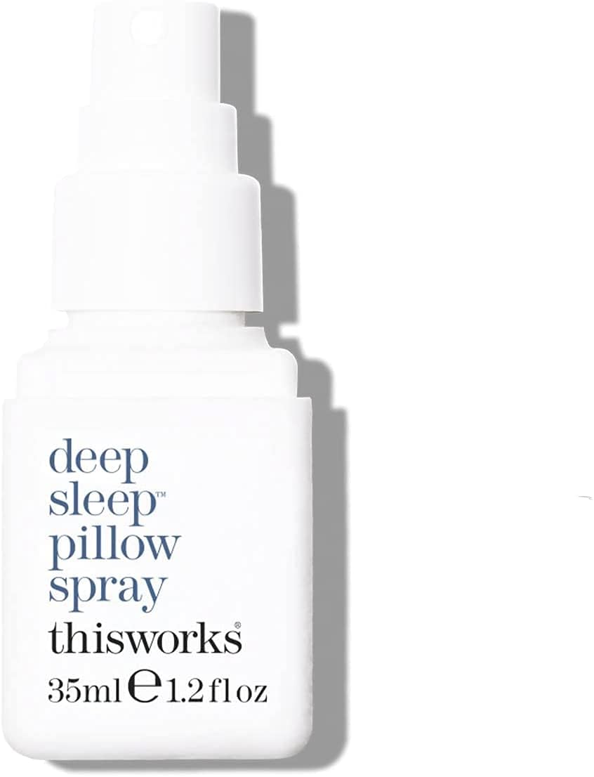 Applying spray to bed linen for restful sleep