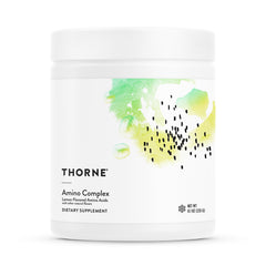 THORNE Amino Complex bottle on a gym counter, supporting lean muscle and recovery.