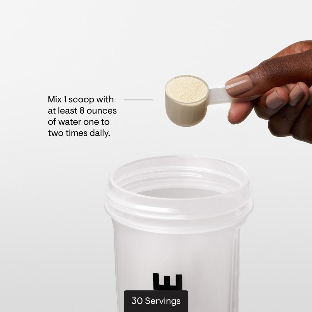 THORNE Amino Complex glass with powder dissolving into a refreshing drink.