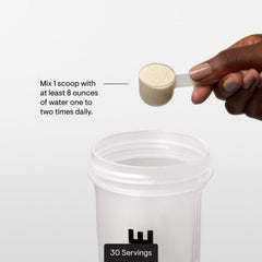 THORNE Amino Complex glass with powder dissolving into a refreshing drink.