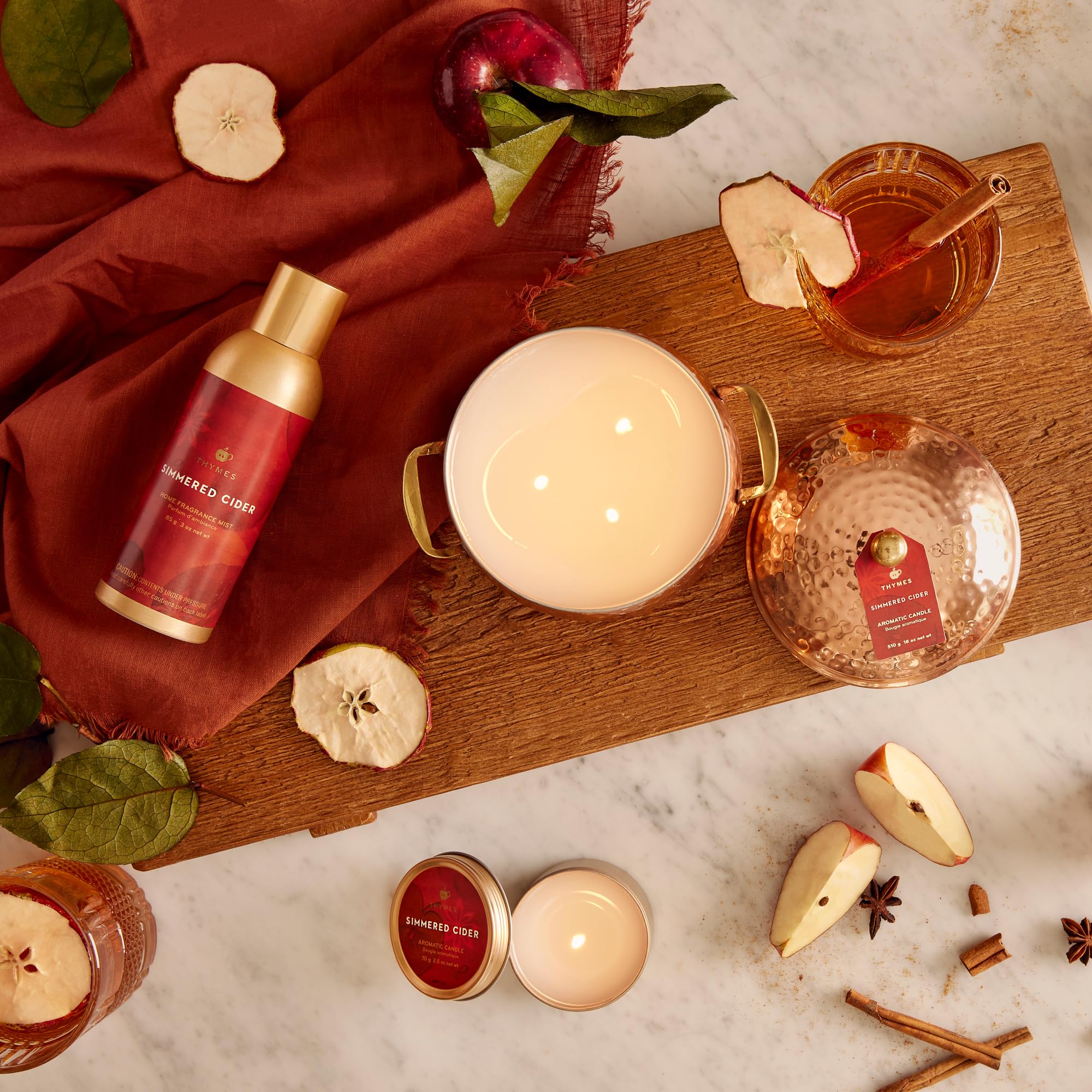Thymes Simmered Cider placed on a styled shelf adding seasonal fragrance appeal