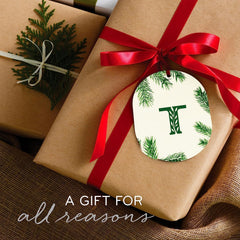 Warm glow of Thymes Frasier Fir travel tin burning.