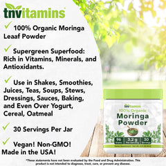 Moringa powder sprinkled from a scoop on a wooden surface