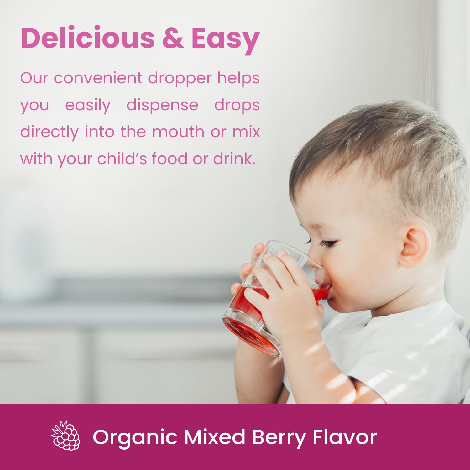 Toddler taking berry-flavored iron drops