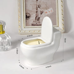 Unlit toilet-shaped candle in a home setting