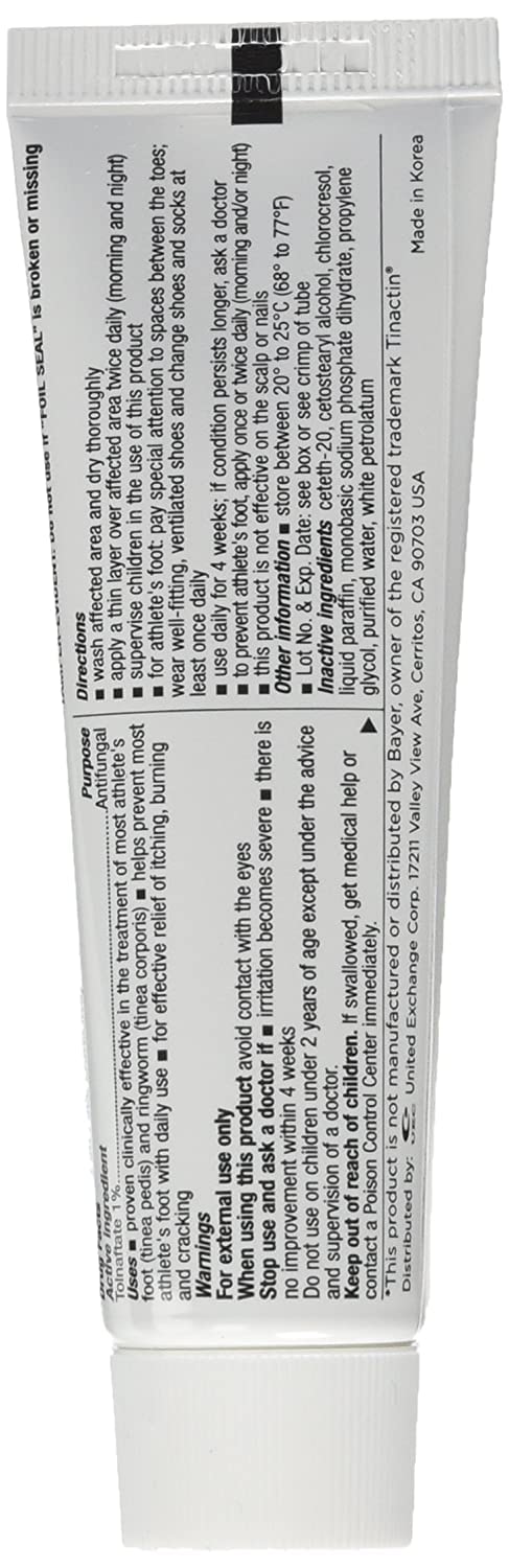 Tolnaftate antifungal cream being applied on foot for symptom relief.