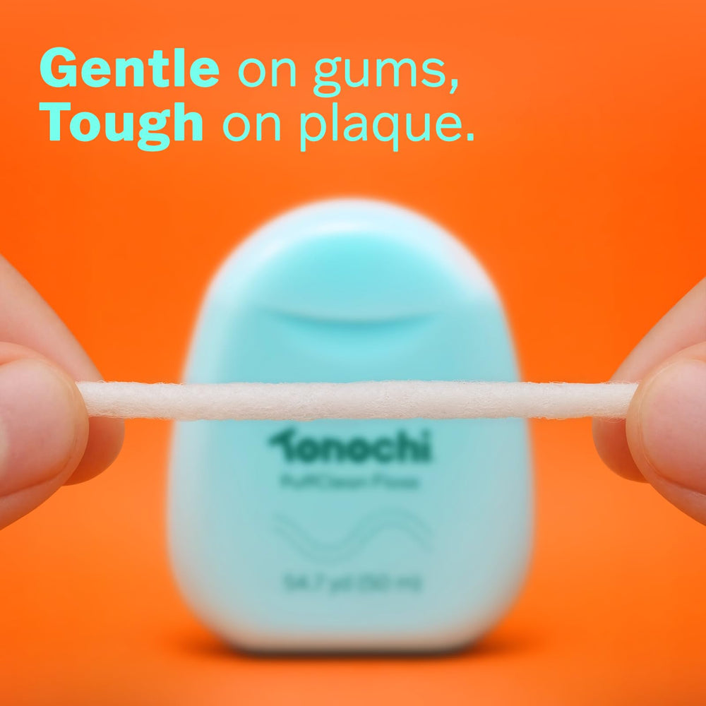 Beeswax-coated floss gliding smoothly between teeth