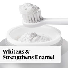 Toothbrush dipped into whitening powder for immediate whitening