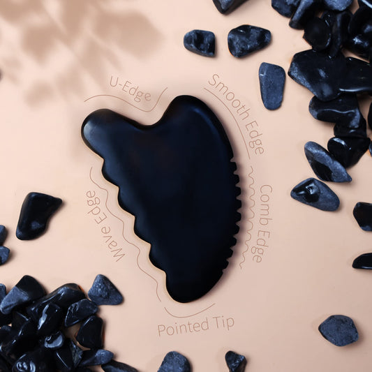 Natural SiBin Bian stone Gua Sha tool in hand