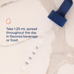 Dropper dispensing a precise dose of Trace Minerals Ionic Boron.