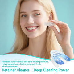 Hands cleaning a dental appliance with retainer cleaner
