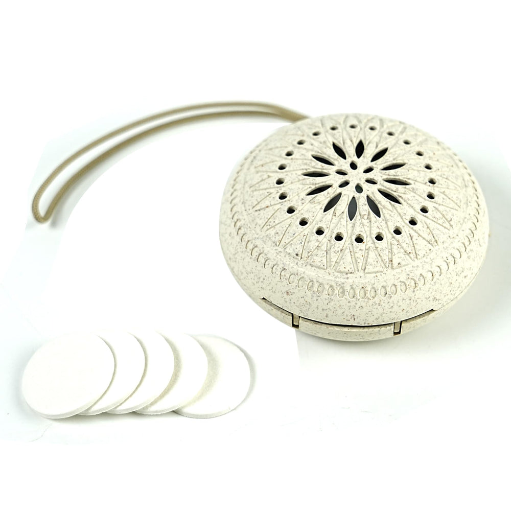 Drop essential oil onto cotton pad inside diffuser