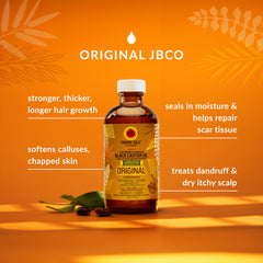 Castor oil being applied to the scalp