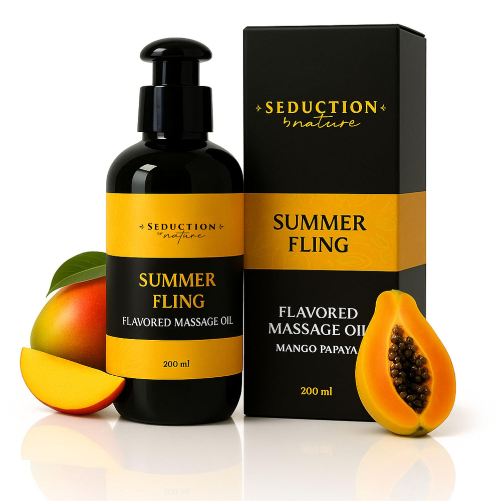 Bottle of Tropical Flavored Massage Oil with mango and papaya in the foreground