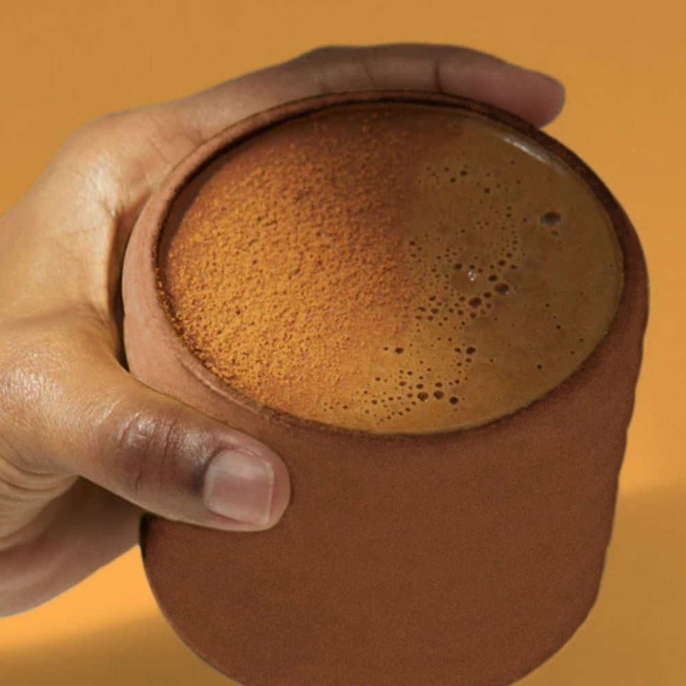 Morning energy concept with a cup and powder scoop of TruBrain Morning Mushrooms