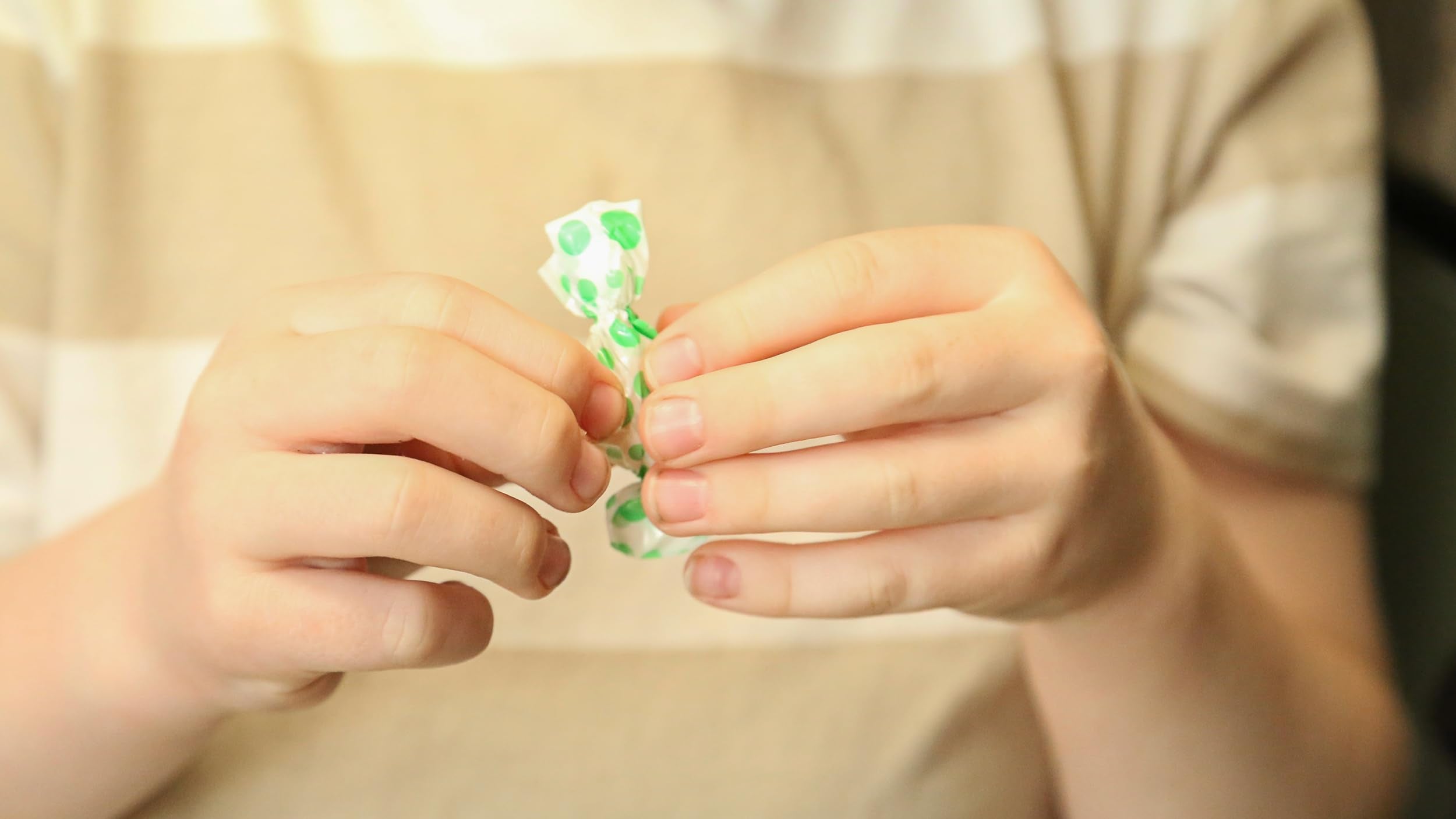 Tummydrops peppermint lozenge close-up emphasizes pure peppermint oils.