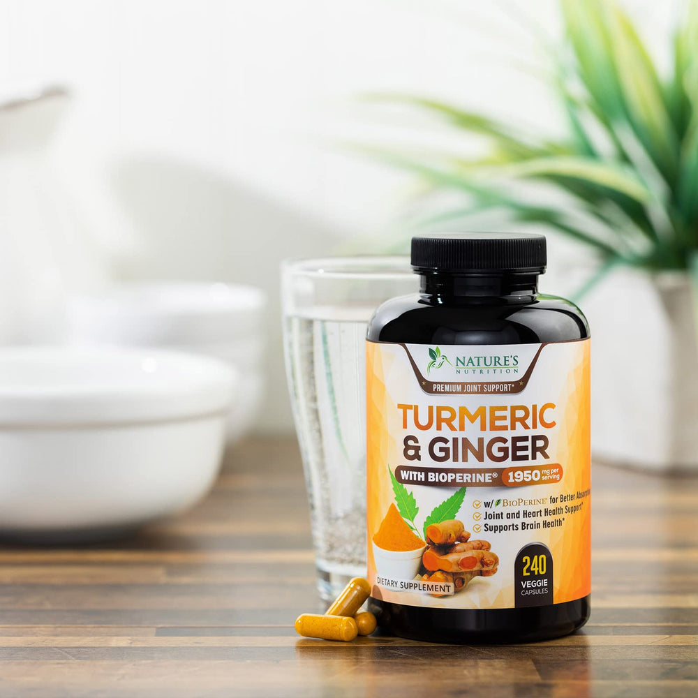 Turmeric Curcumin capsules shown with a glass of water