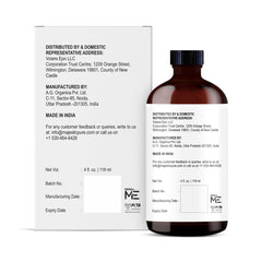 Turmeric essential oil bottle on white background