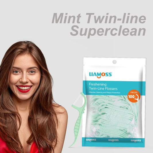 Close-up of mint-flavored dual-action floss sticks
