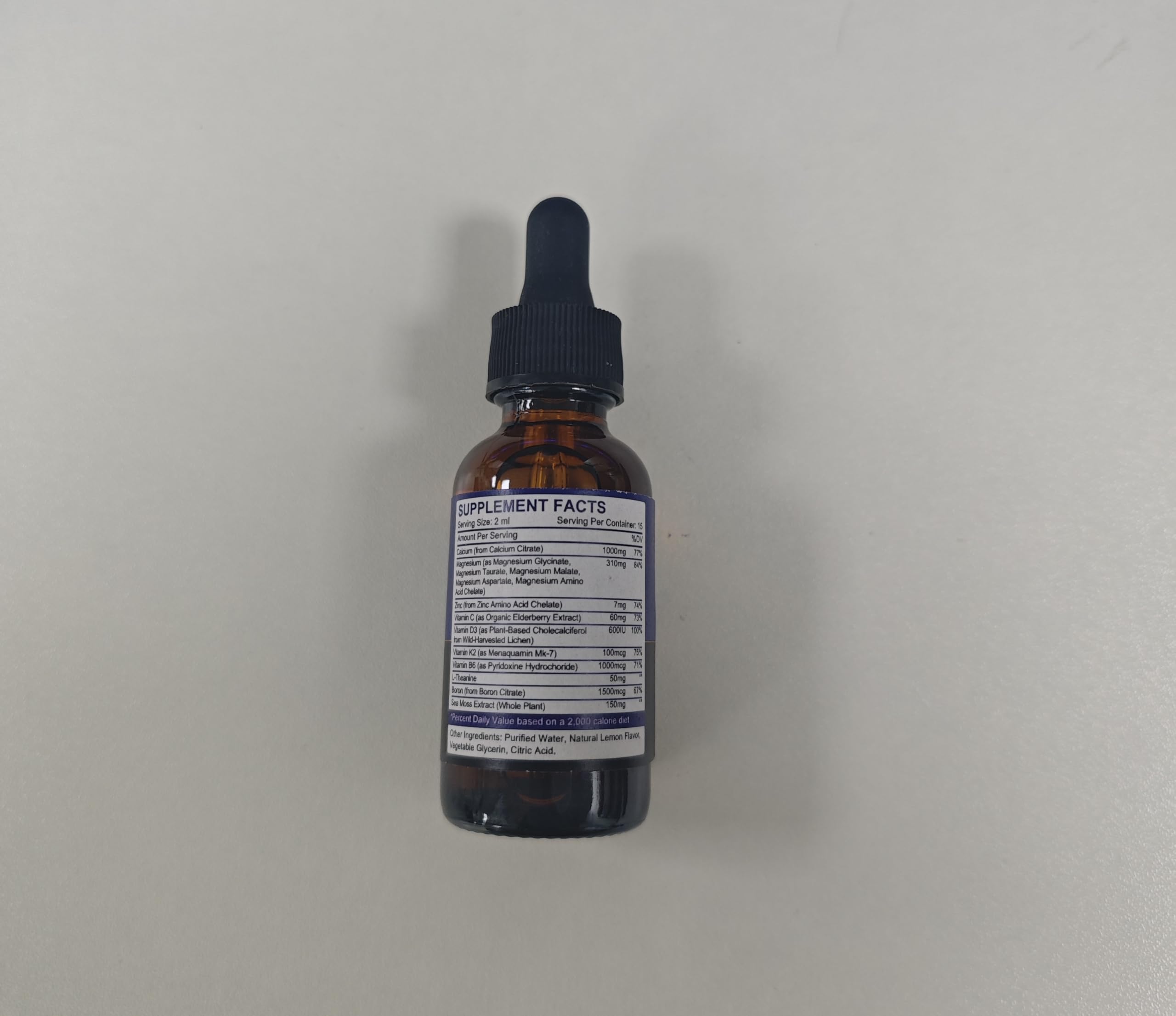 Side view of the two-pack calcium magnesium zinc liquid drops