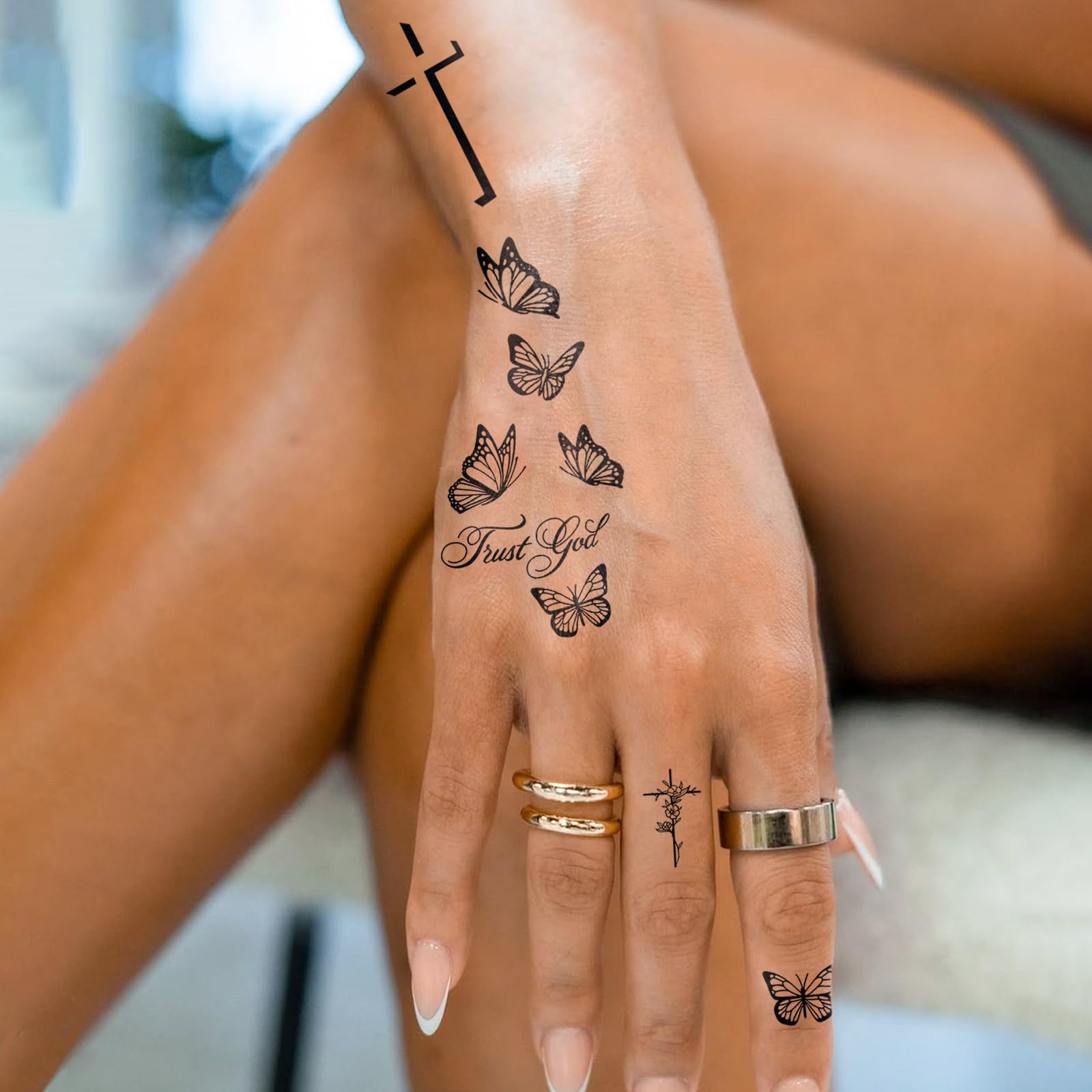 UBICA Tattoo Tech butterfly-cross closeup showing crisp black lines