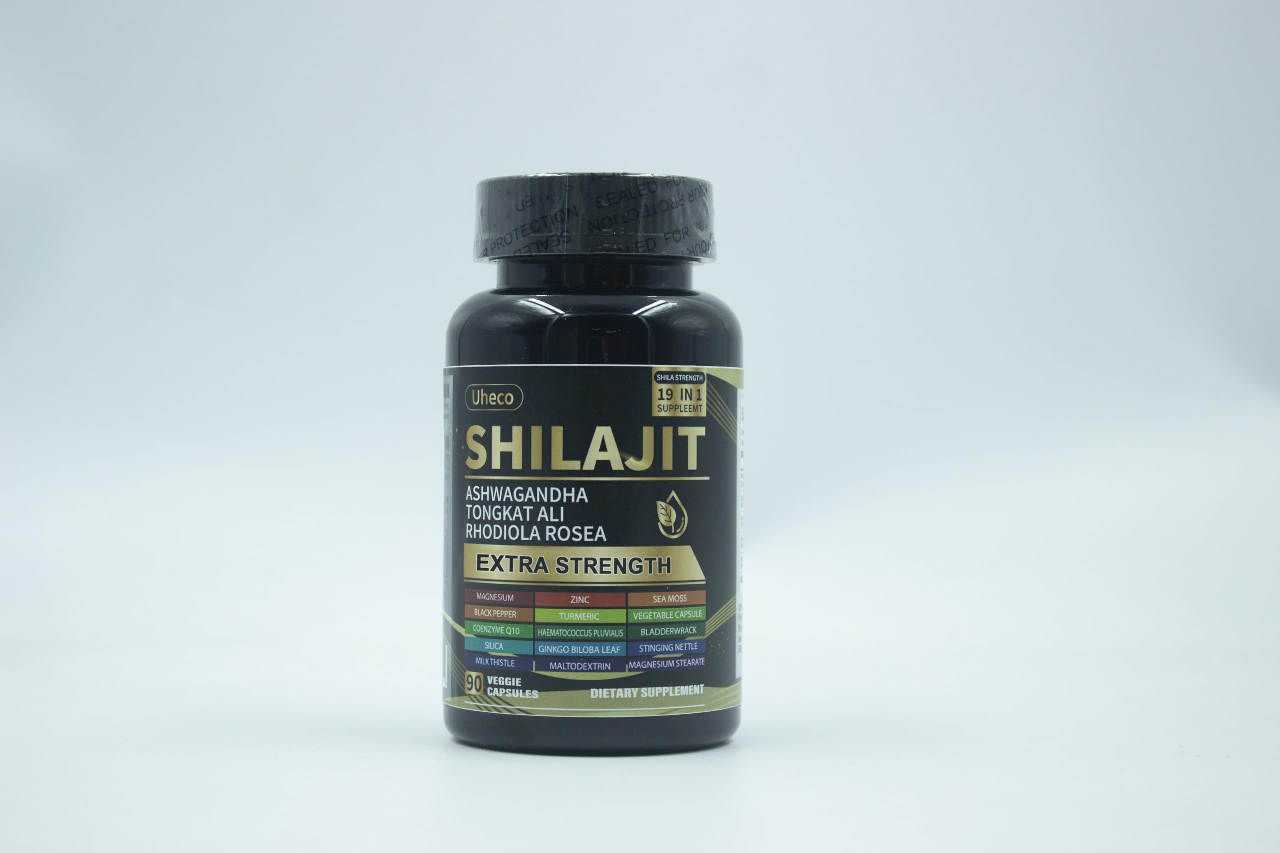 Capsules spilling beside herbal ingredients