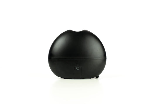 Ultransmit ipple ultrasonic diffuser emitting visible mist at desk