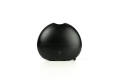 Ultransmit ipple ultrasonic diffuser emitting visible mist at desk
