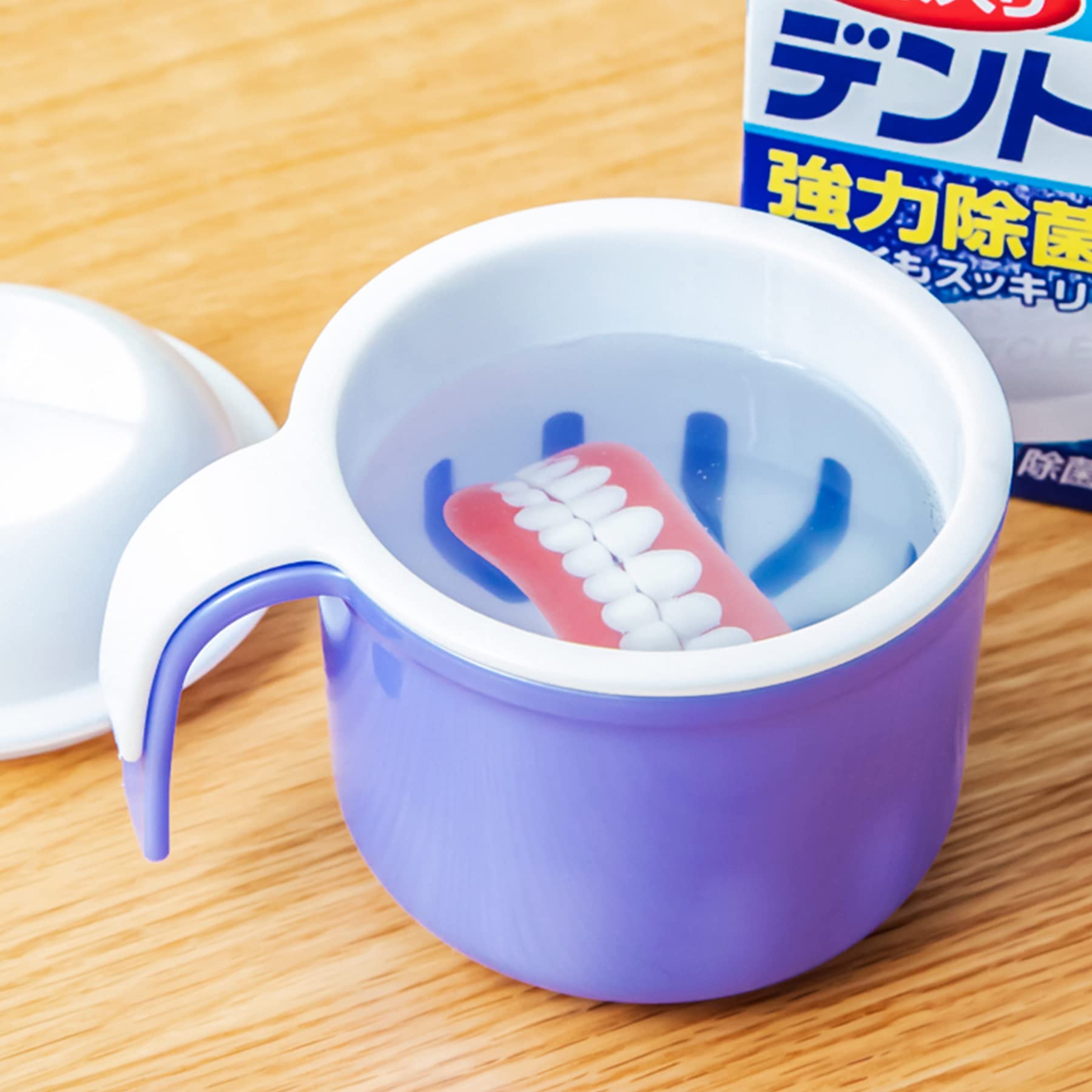 Unboxing view of the denture bath cup set