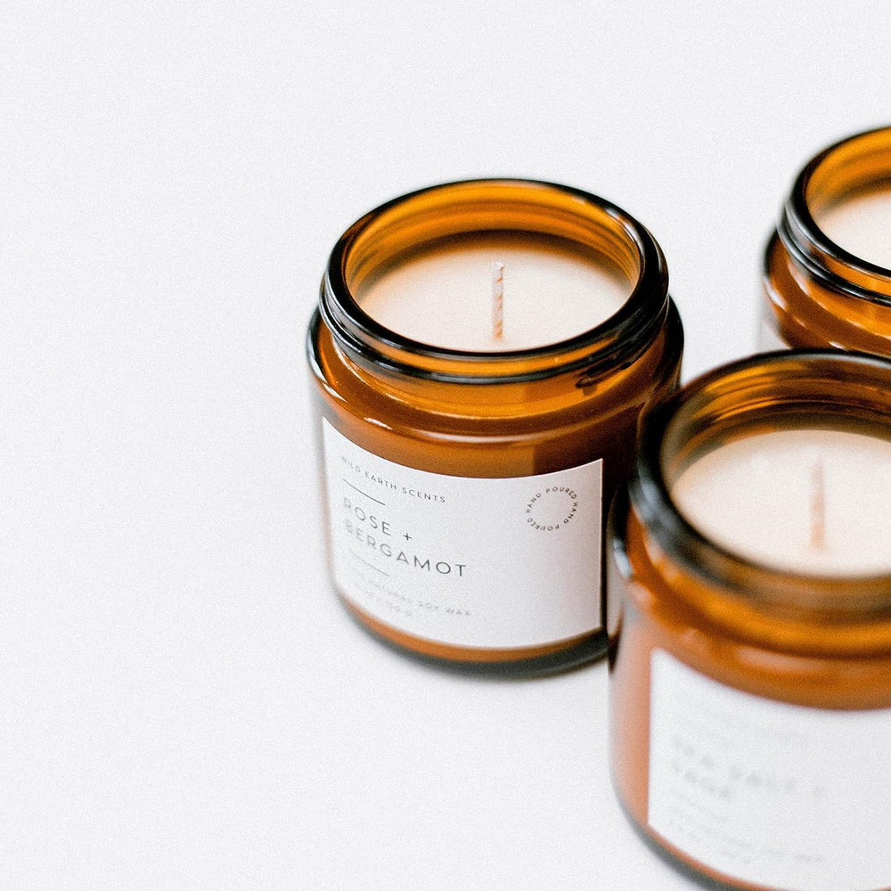 Unboxme Gifts hand-poured soy wax candle in a glass jar for clean burn.