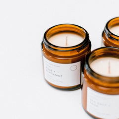 Unboxme Gifts hand-poured soy wax candle in a glass jar for clean burn.