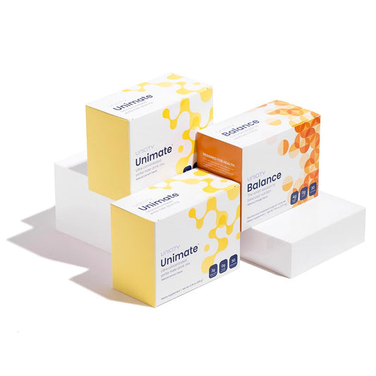 Unicity Feel Great System Natural Orange Lemon bottle on kitchen counter